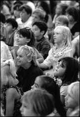 Kids enjoying a performance